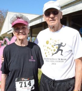 Photo of Jean and Mac McCrady in running attire after a race