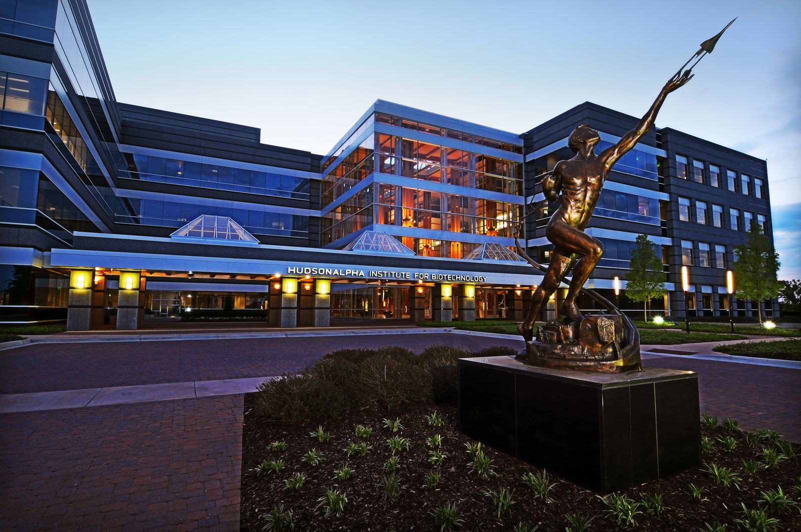The bronze Power of Thought statue in front of HudsonAlpha